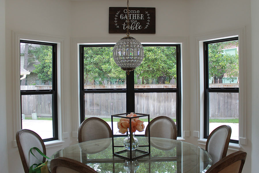 home interior with table, chairs. Features aluminum window